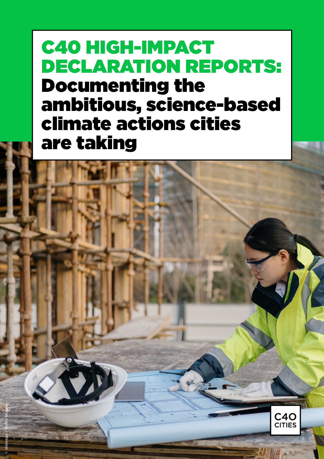 The cover image for "C40 Declaration Reports: Documenting the ambitious, science-based climate actions cities are taking", published in February 2022. A woman is pictured working on a construction site looking at a building design.
