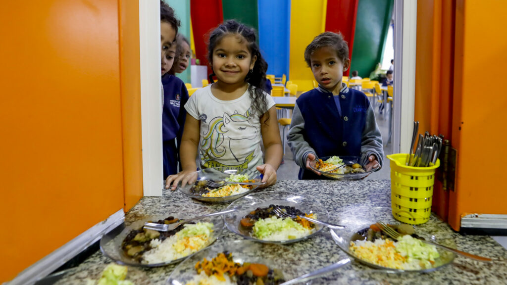 The Sustainable School Menu Programme on Monday, Oct. 3, 2022 in Sao Paulo, Brazil. In this image, the children receive vegetarian school meals.Through this project, São Paulo is taking action to mitigate food insecurity, promote behaviour change and reduce its environmental impact.(Marcelo Chello/AP Images for C40)