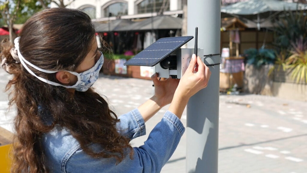 Installing a Clarity air quality monitoring sensor. © Clarity.