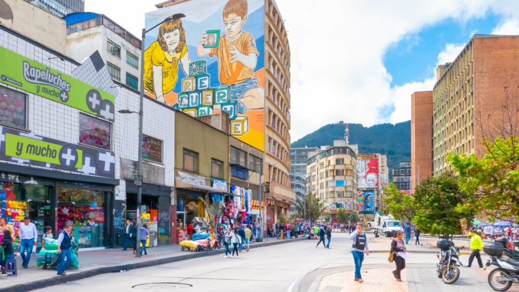 Bogotá, Colombia, city people in Jimenez of Quesada avenue featuring colourful a building that houses shops, restaurants and cafes.