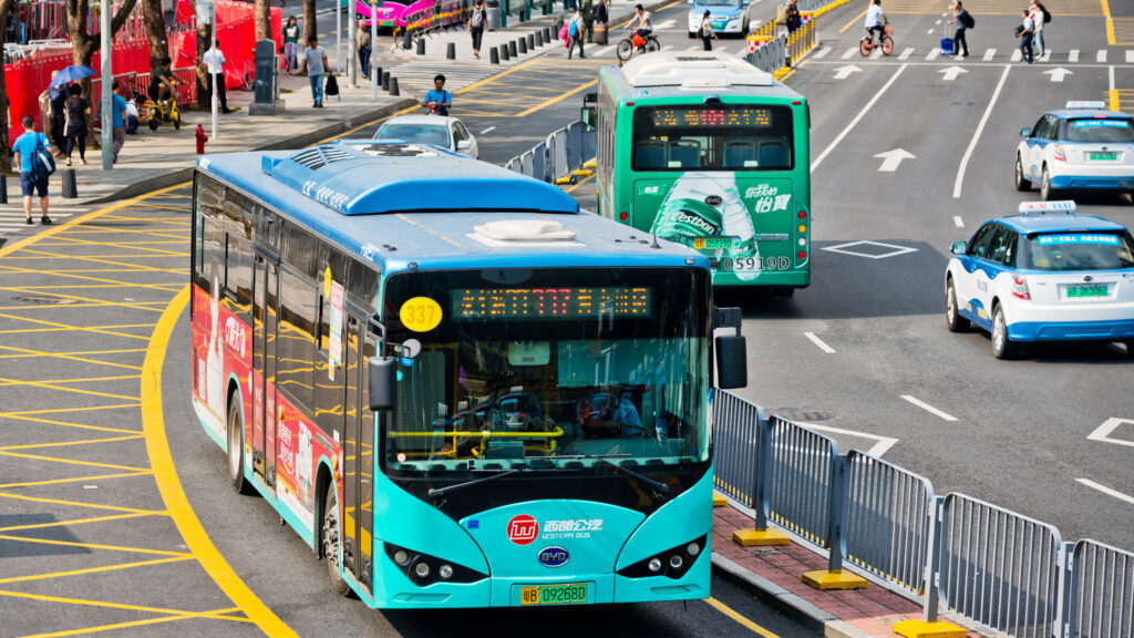 Shenzhen, China - October 22, 2019: BYD Electric Bus driving near train station. Shenzhen, the ultra-modern city with 15 million people is located in southern China.