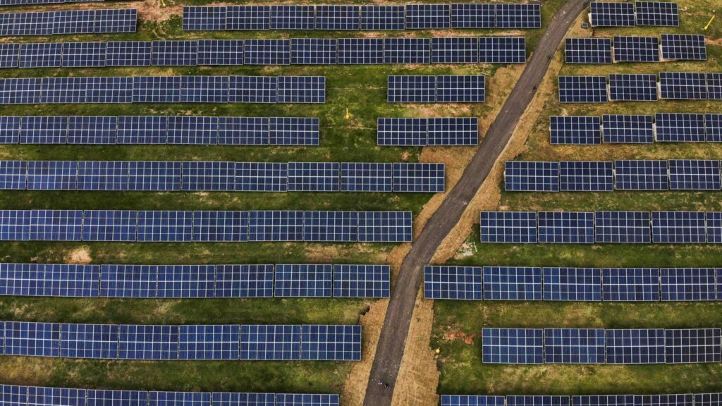 Birds-eye view of hundreds of solar panels in Curitiba