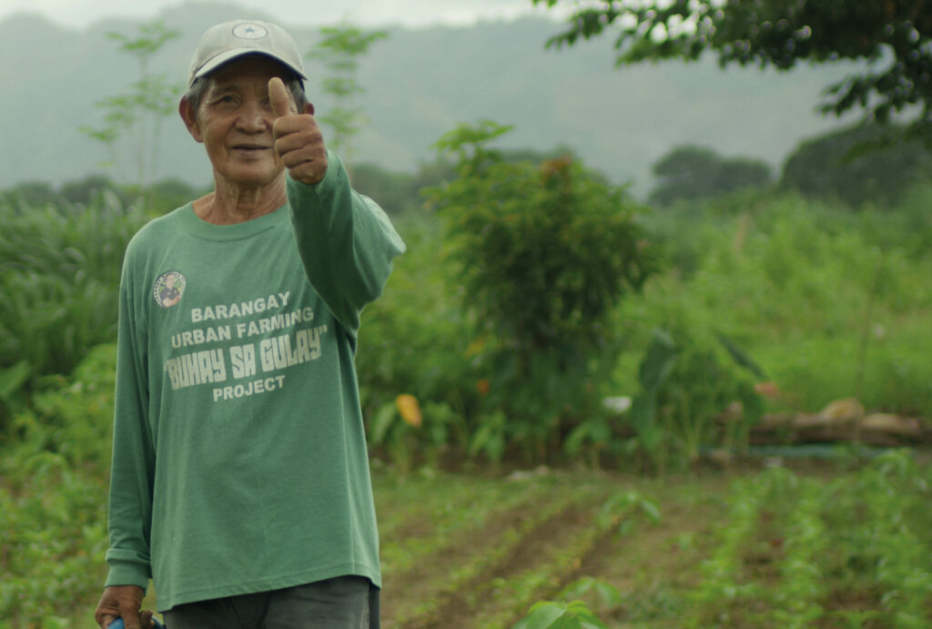 A still from C40's #GreenJobsNow film from the City Stories series showing a worker from Quezon City in an urban farm.